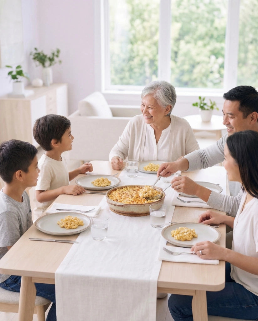 A multi-generational family enjoying a cheesy meal together